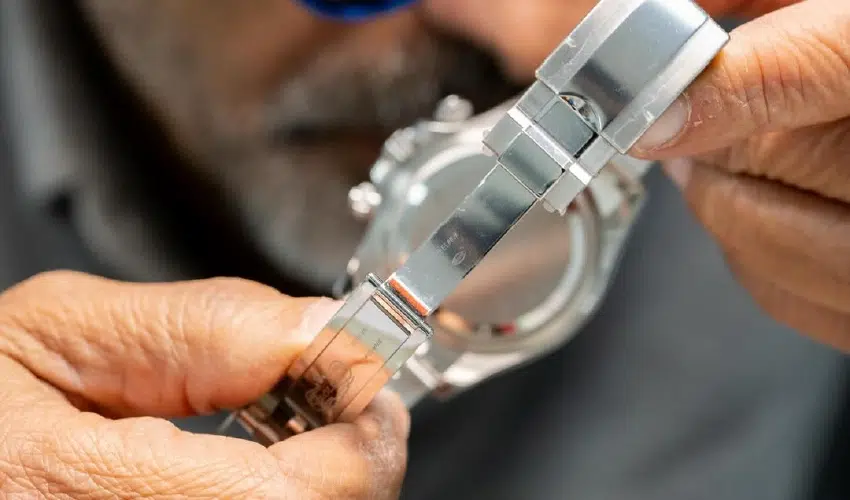 Aiman Moner inspecting the Rolex watch