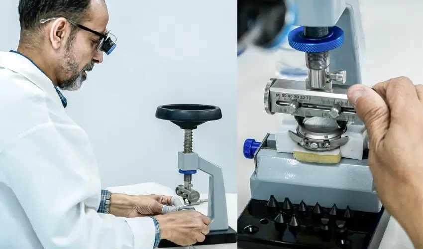 Watchmaker Aiman Moner uses a benchtop case opener press to unscrew the case back of a chronograph watch.