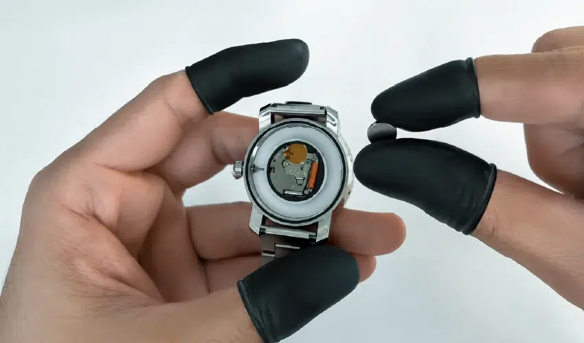 Release and remove the old battery