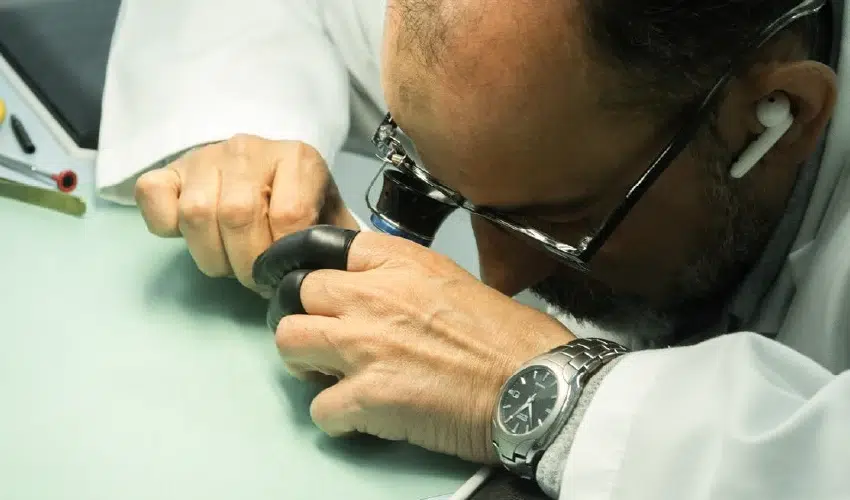 Aiman Moner inspecting and cleaning the contacts